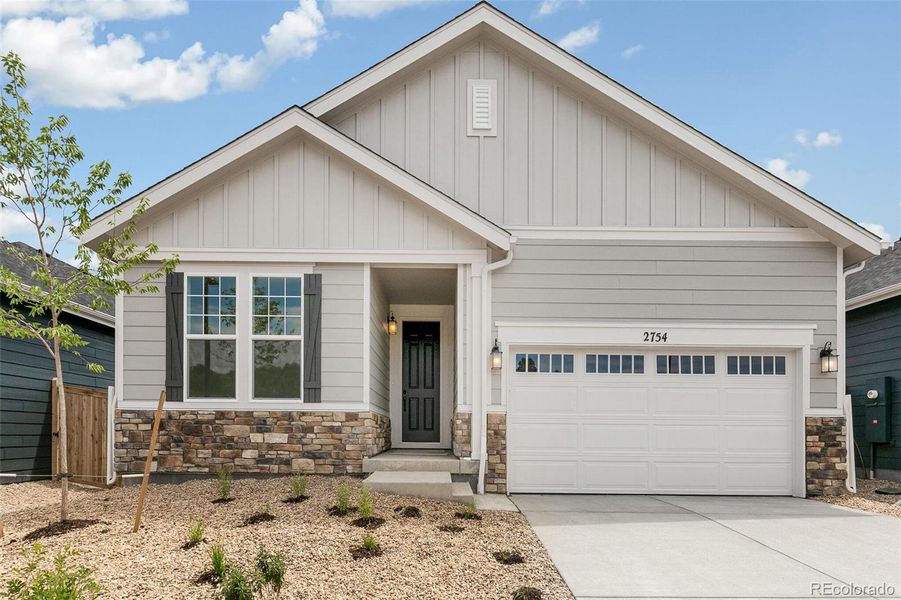 Front exterior of a new home in Terrain Oak Valley, Castle Rock, CO, highlighting curb appeal (Image 24).