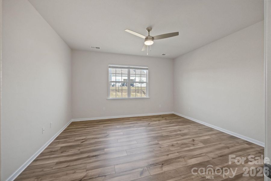 PRIMARY Bedroom off the Great Room with views to the backyard.  Nice size room with ensuite bath and large closet walk-in room.