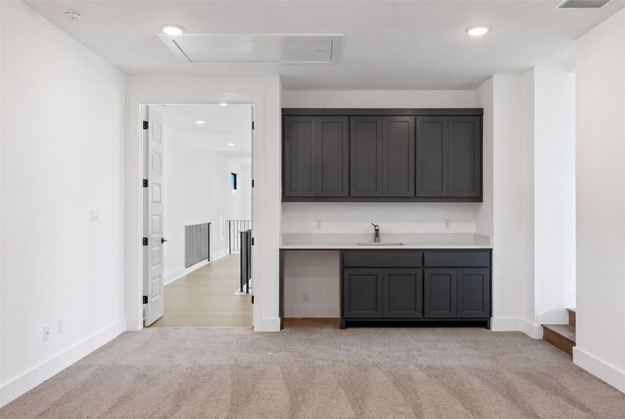 Furnished interior view inside a new home in The Estates at Rough Hollow Vista Ridge, Lakeway (Image 33).