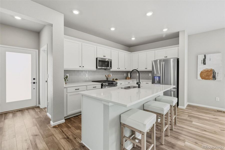 Furnished interior view inside a new home in Woodrose at Painted Prairie, Aurora (Image 17).