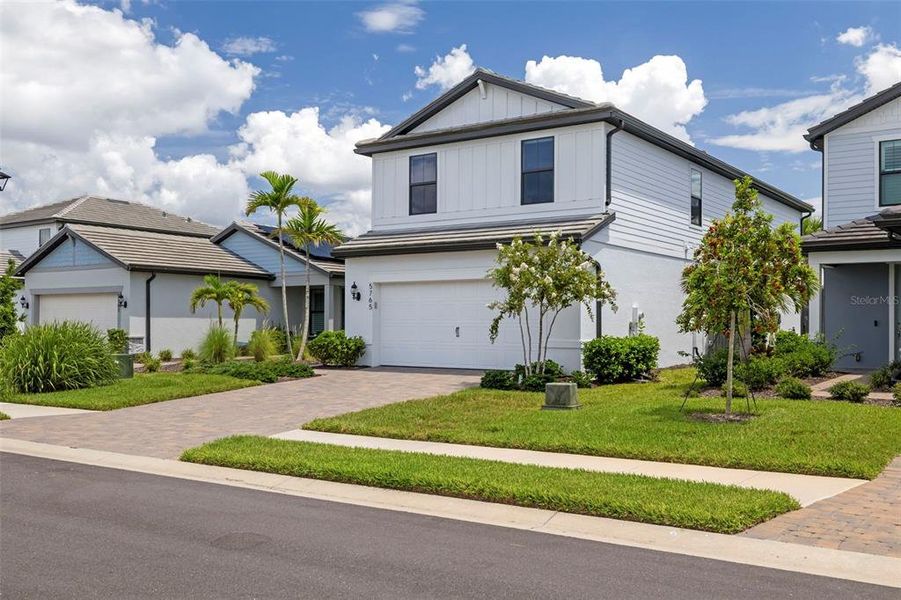 Front exterior of a new home in , Bradenton, FL, highlighting curb appeal (Image 23).