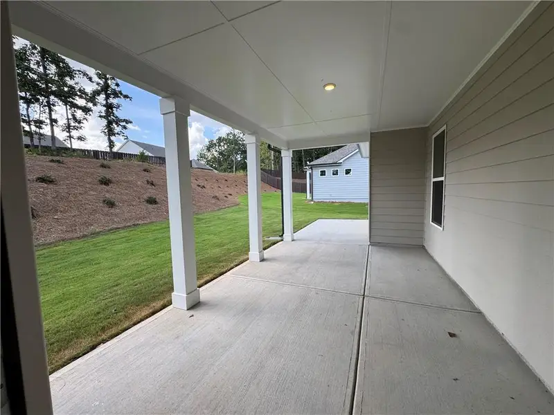 Exterior details and patio area of a home in Rosewood Lake Preserve, Hoschton (Image 16).