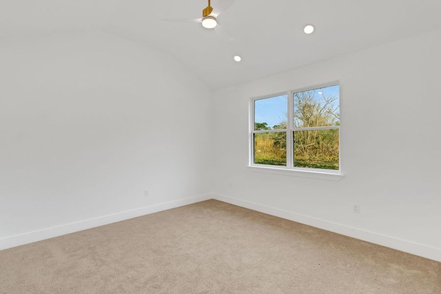 Another view of primary bedroom