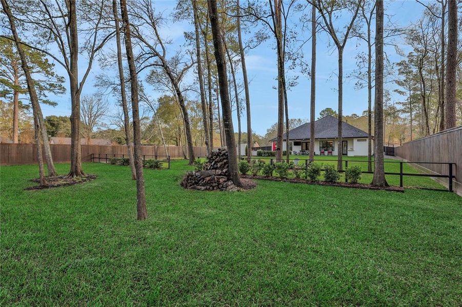 Cross fenced in the back to break up the yard. Nicely landscaped. Ample space for storage unit or workshop if you wanted it.