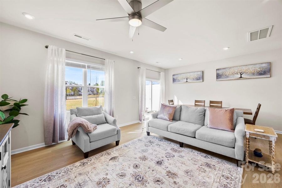 Living area with sliding door to backtard