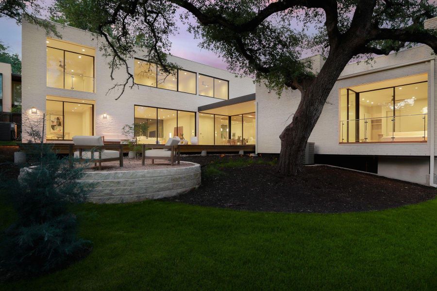 Back of property featuring a yard and a deck