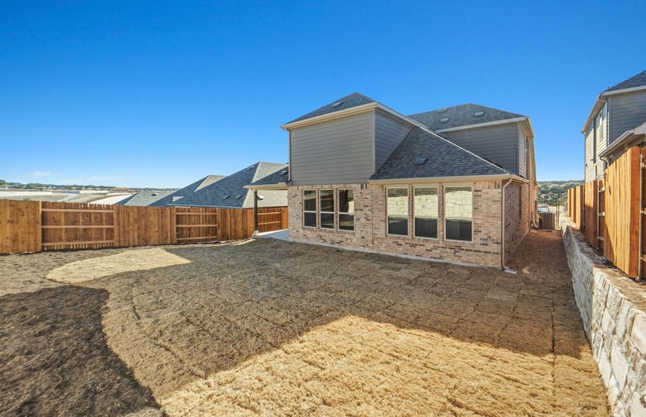 Exterior details and patio area of a home in West Cypress Hills, Spicewood (Image 30).