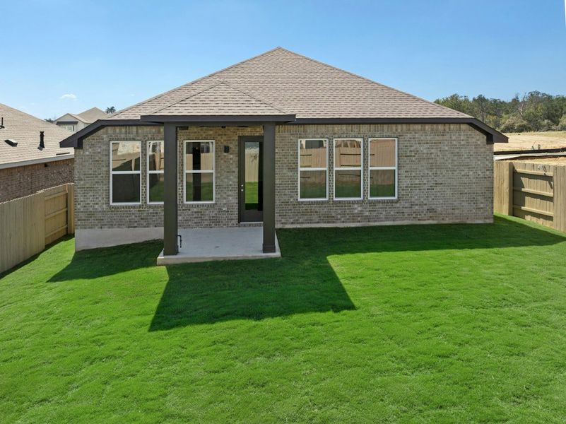 Exterior details and patio area of a home in The Colony, Bastrop (Image 27).