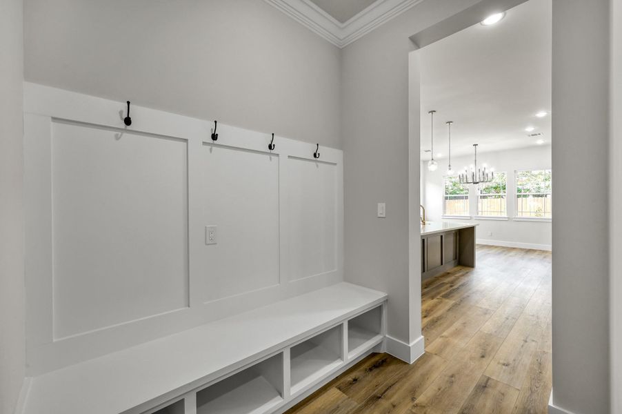 The mudroom area with built-in storage and bench seating is conveniently located off the garage. The mudroom area with built-in storage and bench seating is conveniently located off the garage.