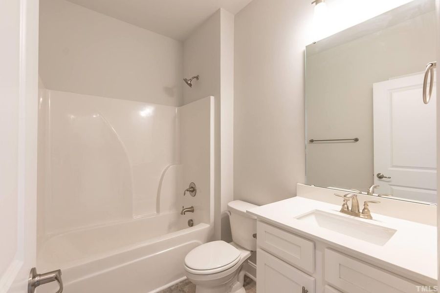 Representative furnished interior of a home built from the 1634 by Adams Homes in Parkland Place, Pace (Image 9).