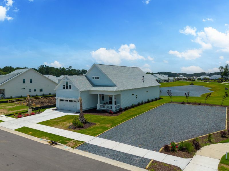 Front exterior of a new home in The Sanctuary at Sunset Beach, Sunset Beach, NC, highlighting curb appeal (Image 26).