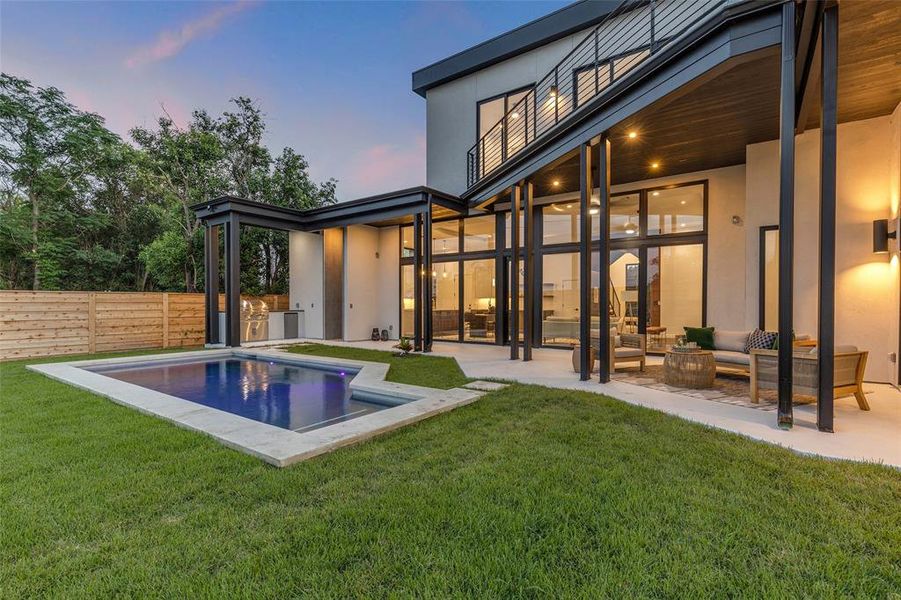 Step into the covered patio, where comfort meets style. Imagine lounging in this cozy outdoor seating area, enjoying the breeze while savoring your favorite drink—perfect for both quiet mornings and lively evenings.