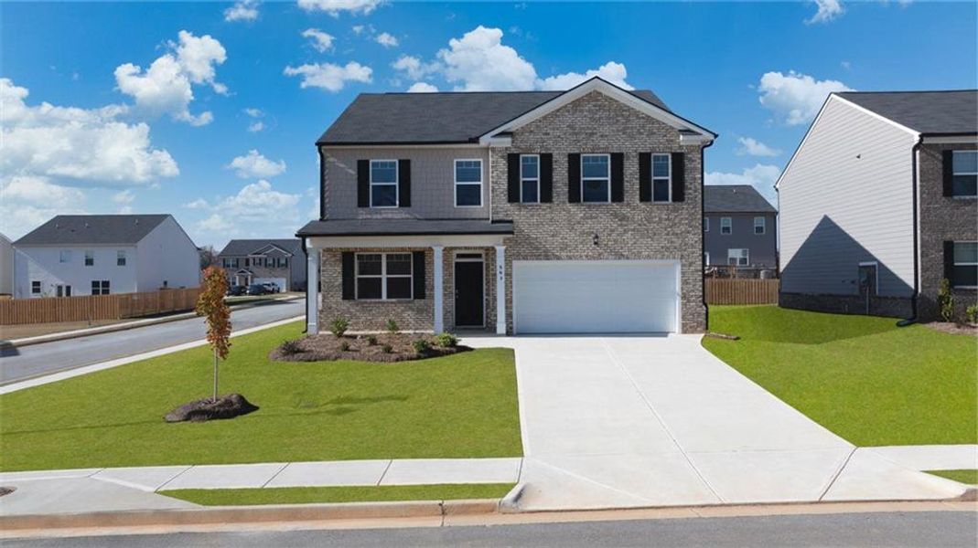 Front exterior of a new home in The Reserve at Calcutta, Stockbridge, GA, highlighting curb appeal (Image 21). Front exterior of a new home in The Reserve at Calcutta, Stockbridge, GA, highlighting curb appeal (Image 21).