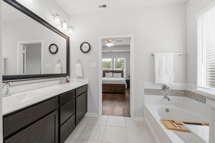 Spa-inspired finishes and a bright, airy layout turn this primary bathroom into a daily retreat. Spa-inspired finishes and a bright, airy layout turn this primary bathroom into a daily retreat.