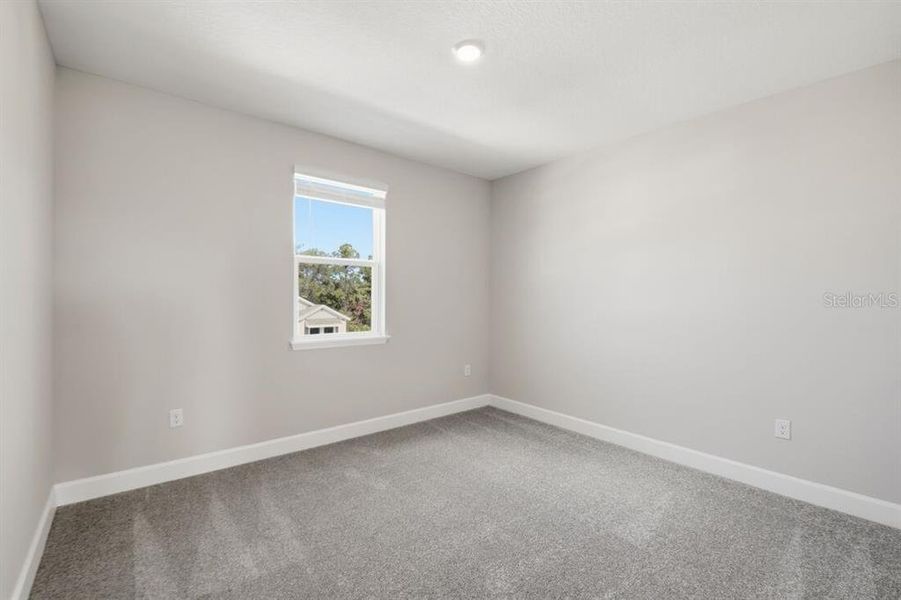 Spacious, unfurnished interior of a new home in Harvest at Ovation, Winter Garden (Image 19).