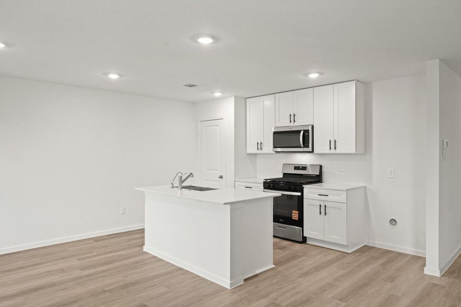 Furnished interior view inside a new home in Sunterra, Katy (Image 6).