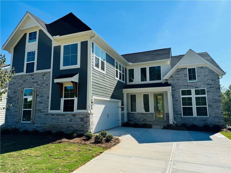 Front exterior of a new home in Twin Lakes, Hoschton, GA, highlighting curb appeal (Image 21).
