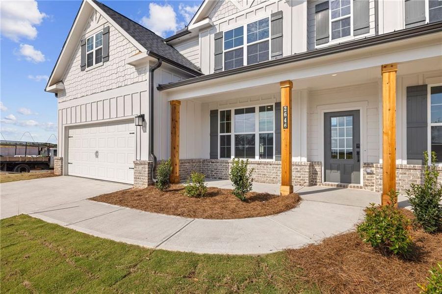 Front exterior of a new home in The Estates at Gainesville Township, Gainesville, GA, highlighting curb appeal (Image 7). Front exterior of a new home in The Estates at Gainesville Township, Gainesville, GA, highlighting curb appeal (Image 7).