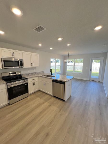 Furnished interior view inside a new home in Allison Acres, Cantonment (Image 6).