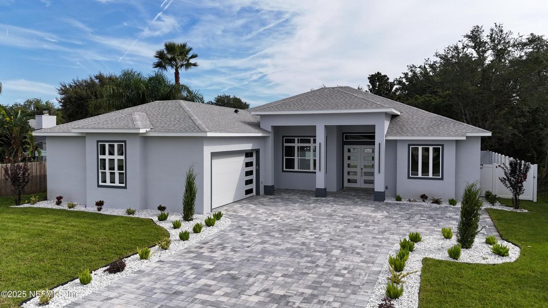 Front exterior of a new home in , Palm Coast, FL, highlighting curb appeal (Image 23). Front exterior of a new home in , Palm Coast, FL, highlighting curb appeal (Image 23).