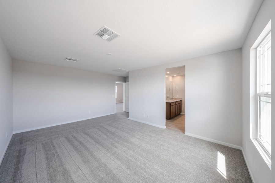 A long hallway with white walls.