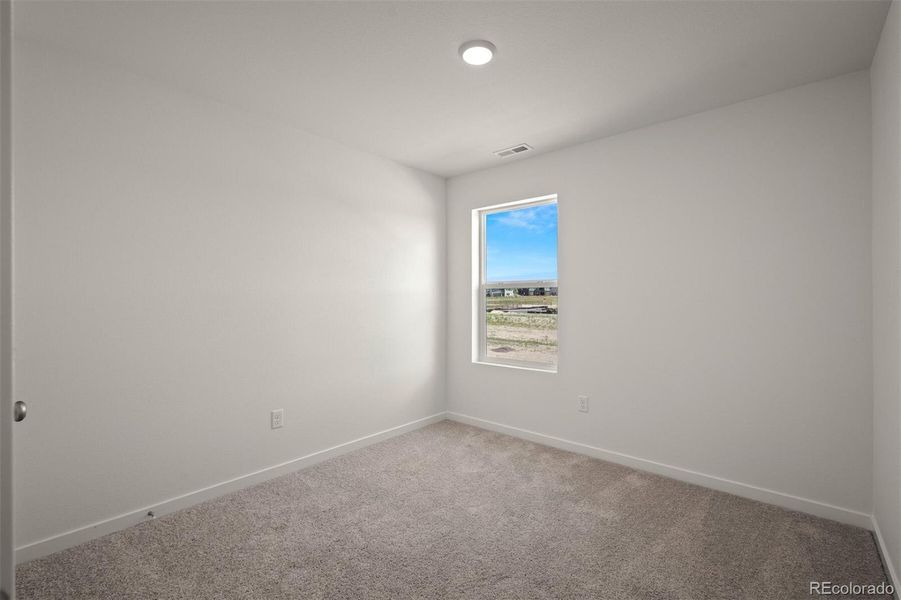 Spacious, unfurnished interior of a new home in Revel Crossing at Wolf Ranch – The Ascent Collection, Colorado Springs (Image 18).