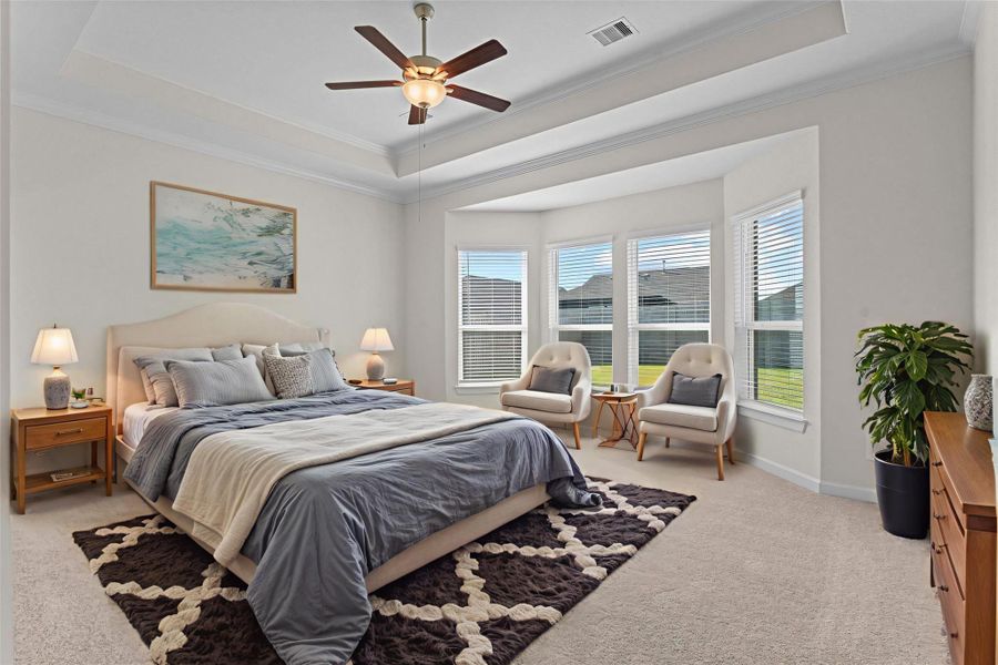 Virtually Staged – Primary bedroom retreat with high tray ceiling trim with crown molding for that custom look and feel!  Then to top off that custom feel the large sitting area with large energy saving windows that provide you with than natural lighting we all want today!  No cookie cutting looking home at all!