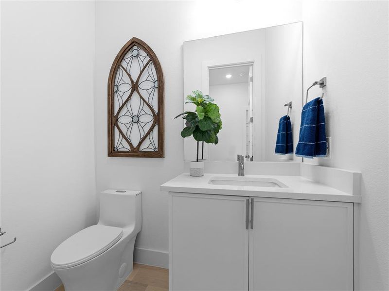 Bathroom featuring vanity and wood finished floors