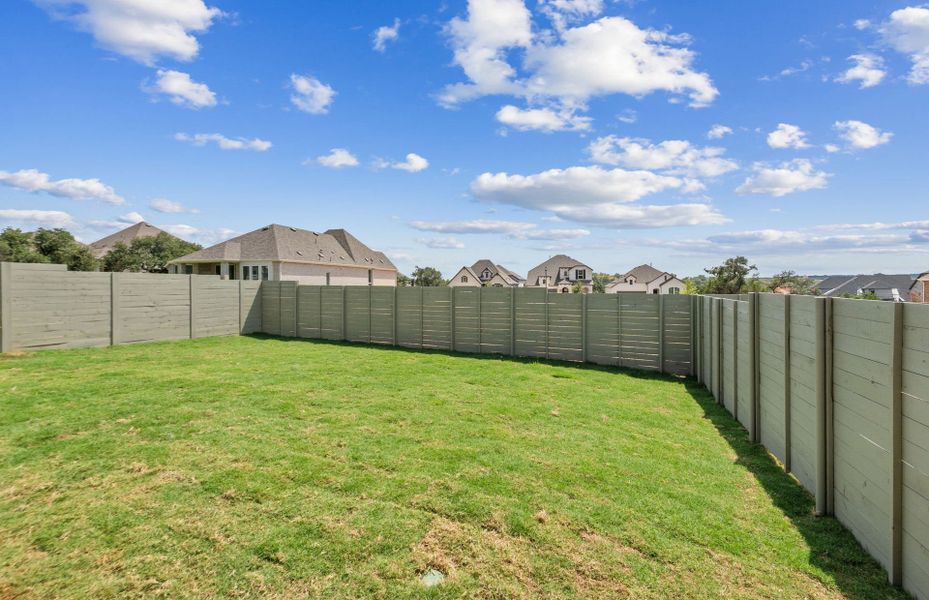 Exterior details and patio area of a home in Wolf Ranch, Georgetown (Image 24).