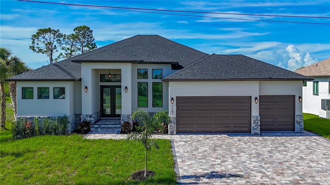 Front exterior of a new home in , Rotonda West, FL, highlighting curb appeal (Image 24). Front exterior of a new home in , Rotonda West, FL, highlighting curb appeal (Image 24).