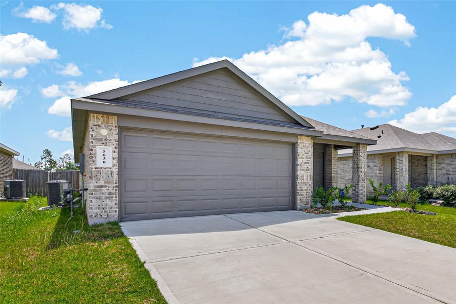 Front exterior of a new home in Breckenridge Forest, Spring, TX, highlighting curb appeal (Image 21).