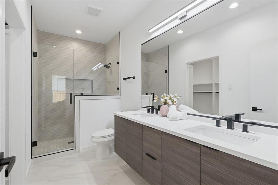 Bathroom with a stall shower, double vanity, recessed lighting, light marble finish floors, and a spacious closet Bathroom with a stall shower, double vanity, recessed lighting, light marble finish floors, and a spacious closet