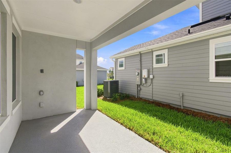 Exterior details and patio area of a home in Laureate Park at Lake Nona - Garden Series, Orlando (Image 3).