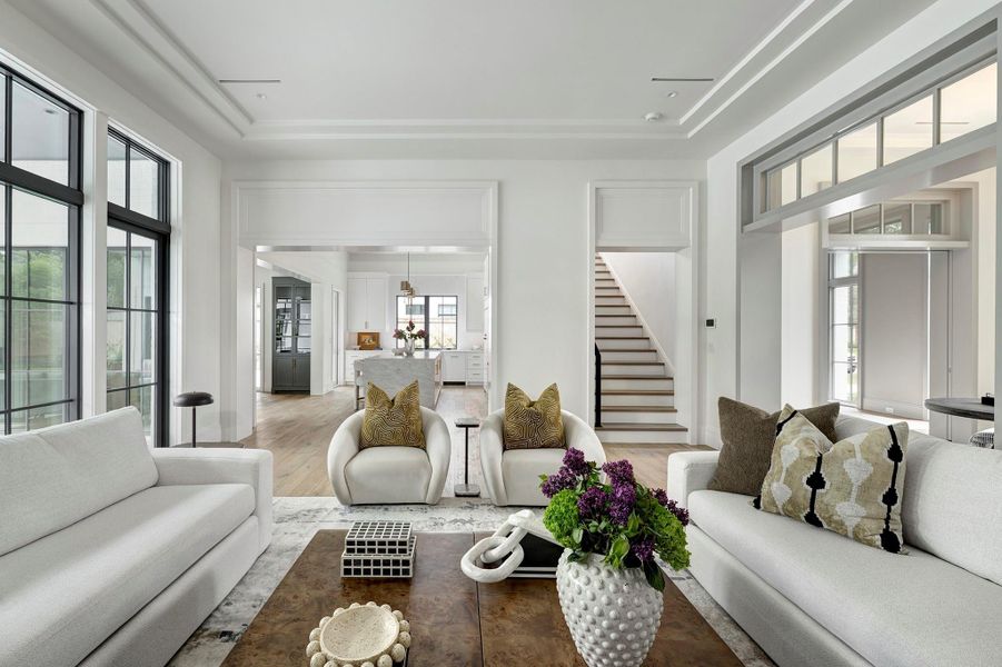 Enjoy varied ceiling details throughout the home.  This 12 ft ceiling is trayed in the living room.