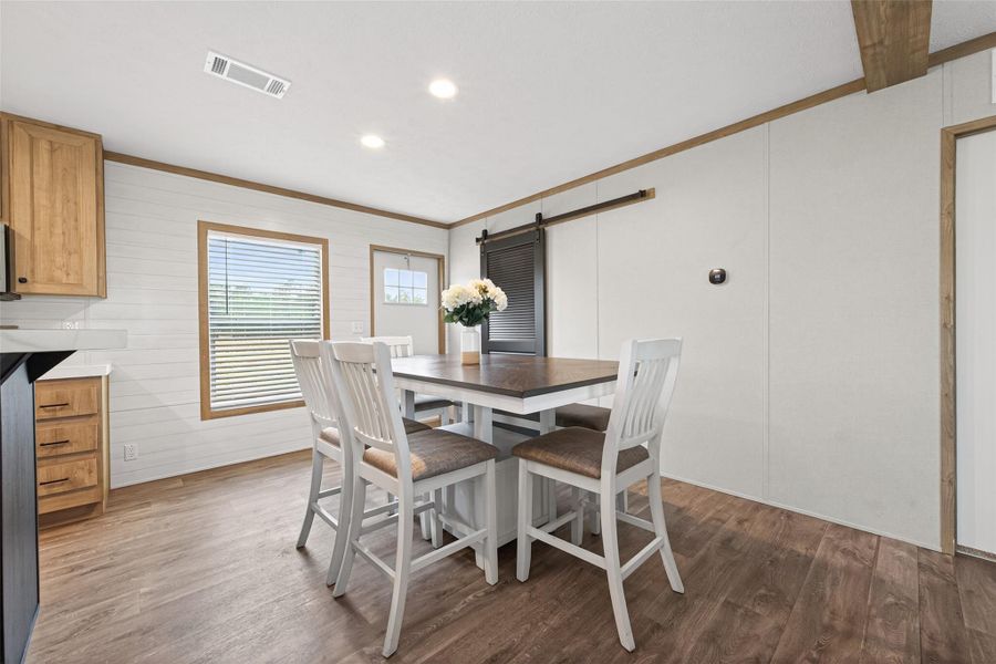 Open dining area conveniently located between the kitchen and living room, ideal for gatherings and daily meals Open dining area conveniently located between the kitchen and living room, ideal for gatherings and daily meals