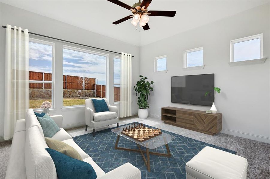 Carpeted living room with ceiling fan