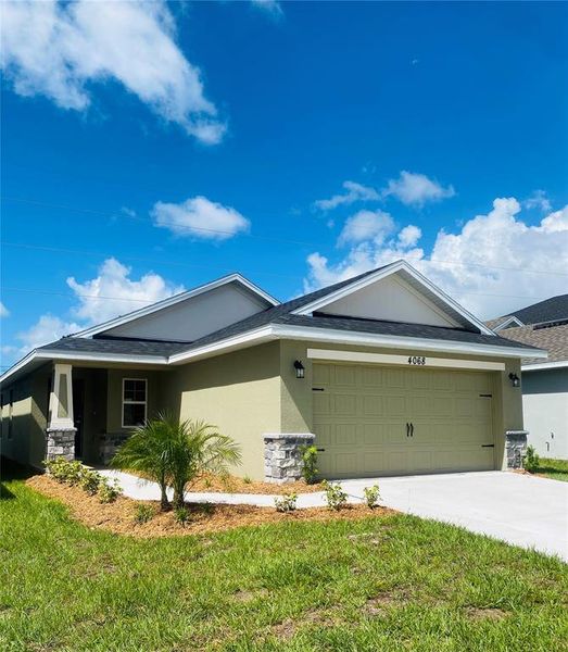 Front exterior of a new home in , St. Cloud, FL, highlighting curb appeal (Image 15).