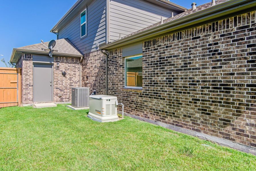Front exterior of a new home in River Ranch Meadows, Dayton, TX, highlighting curb appeal (Image 2).