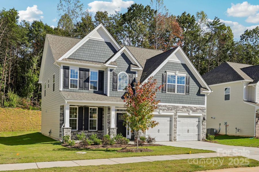 Front exterior of a new home in Falls Cove, Troutman, NC, highlighting curb appeal (Image 2). Front exterior of a new home in Falls Cove, Troutman, NC, highlighting curb appeal (Image 2).