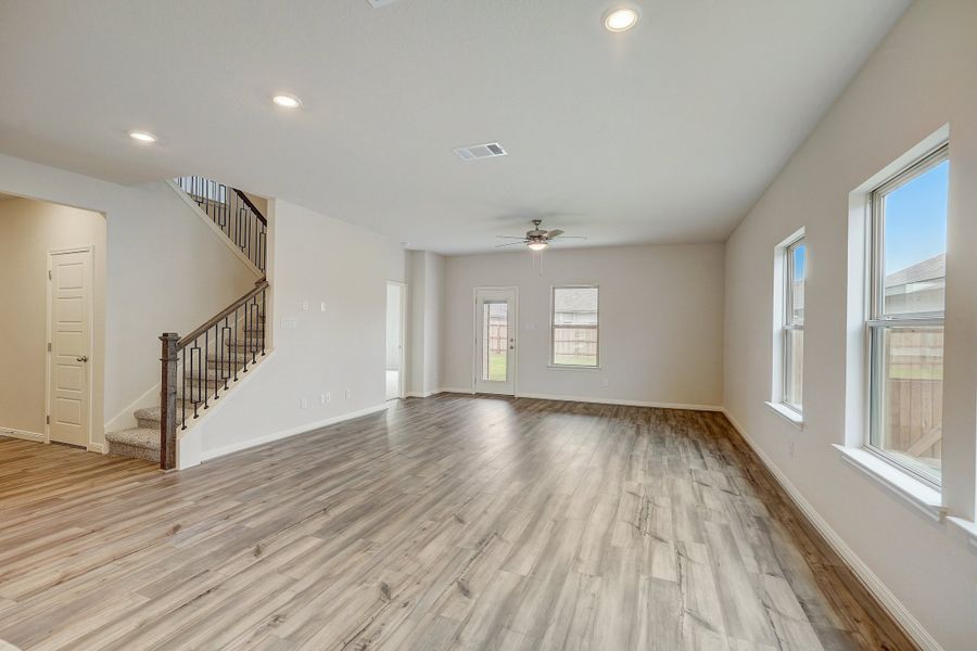 Dining room and living room in the Pearl floorplan at a Meritage Homes community.