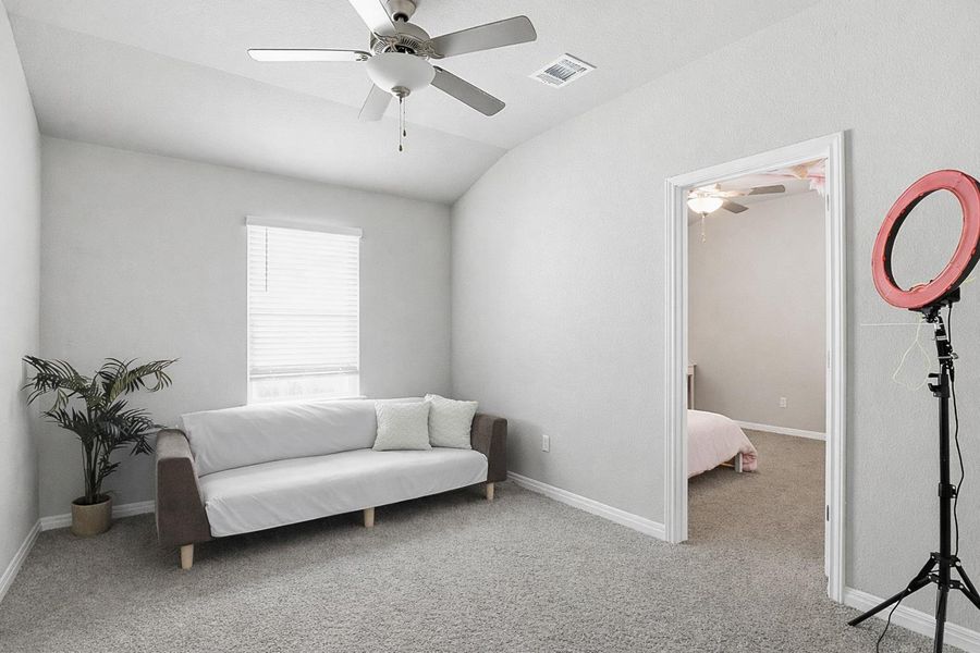 At the center of the home, flanked by two additional secondary bedrooms, lies a bonus space.