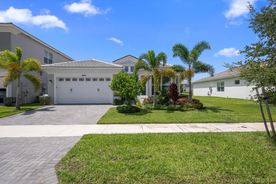 Front exterior of a new home in , Westlake, FL, highlighting curb appeal (Image 36).