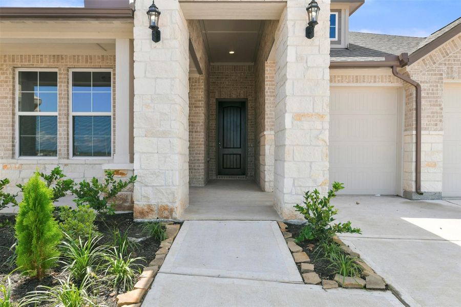 Front exterior of a new home in Lago Mar, Texas City, TX, highlighting curb appeal (Image 18).