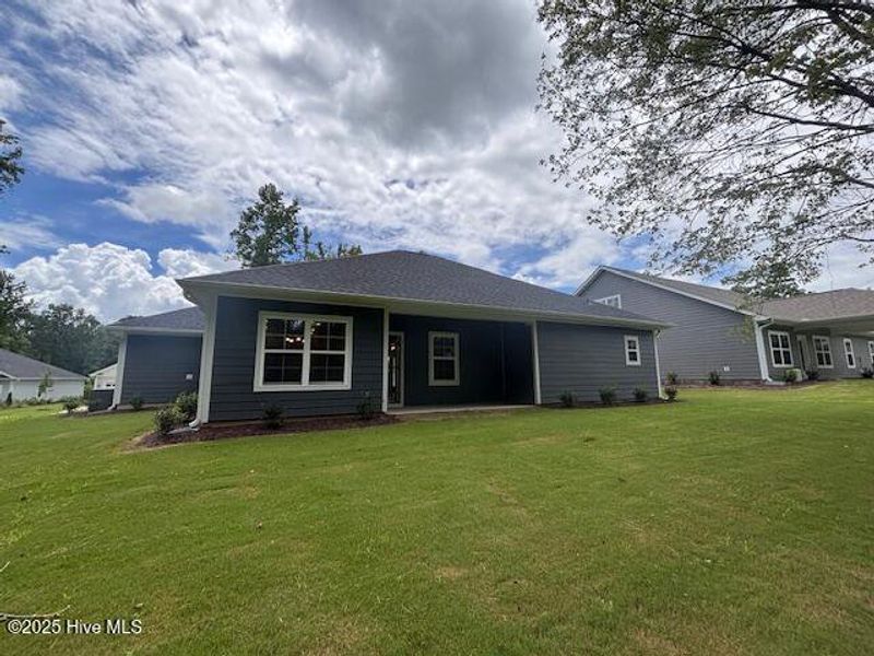 Front exterior of a new home in River Village Square in River Landing, Wallace, NC, highlighting curb appeal (Image 2).