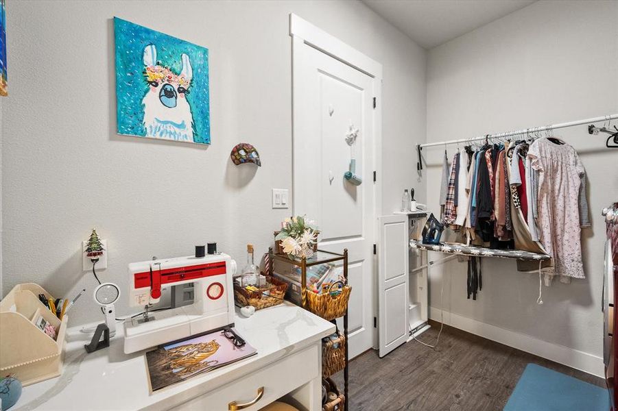 The utility room offers a great space for a craft table, sewing table or what every you want!