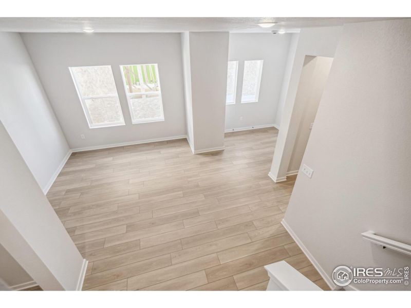 Spacious, unfurnished interior of a new home in Kinston Mainstreet Townhomes, Loveland (Image 31).