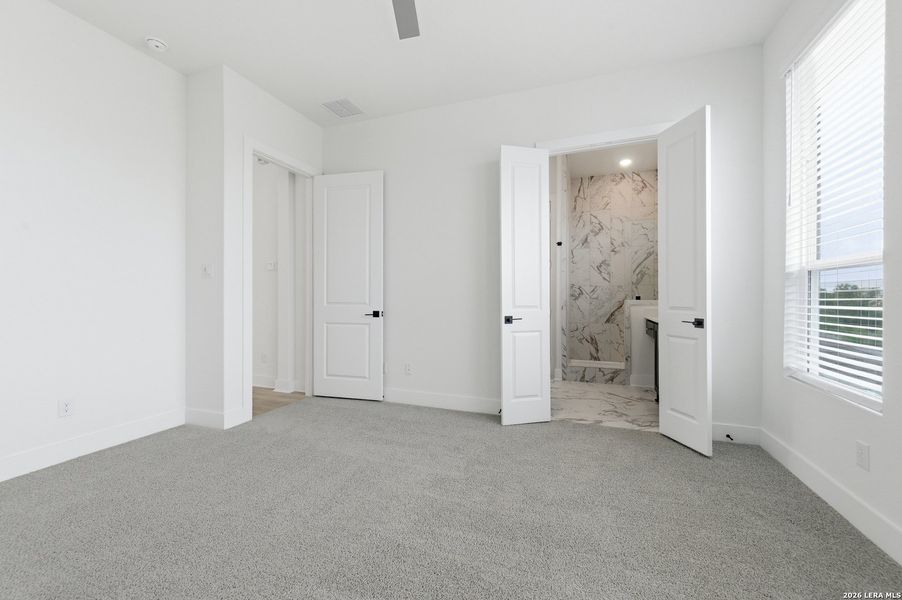 Spacious, unfurnished interior of a new home in Centero at Stone Oak, San Antonio (Image 18).