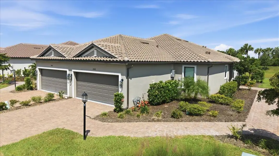 Front exterior of a new home in , Sarasota, FL, highlighting curb appeal (Image 2). Front exterior of a new home in , Sarasota, FL, highlighting curb appeal (Image 2).