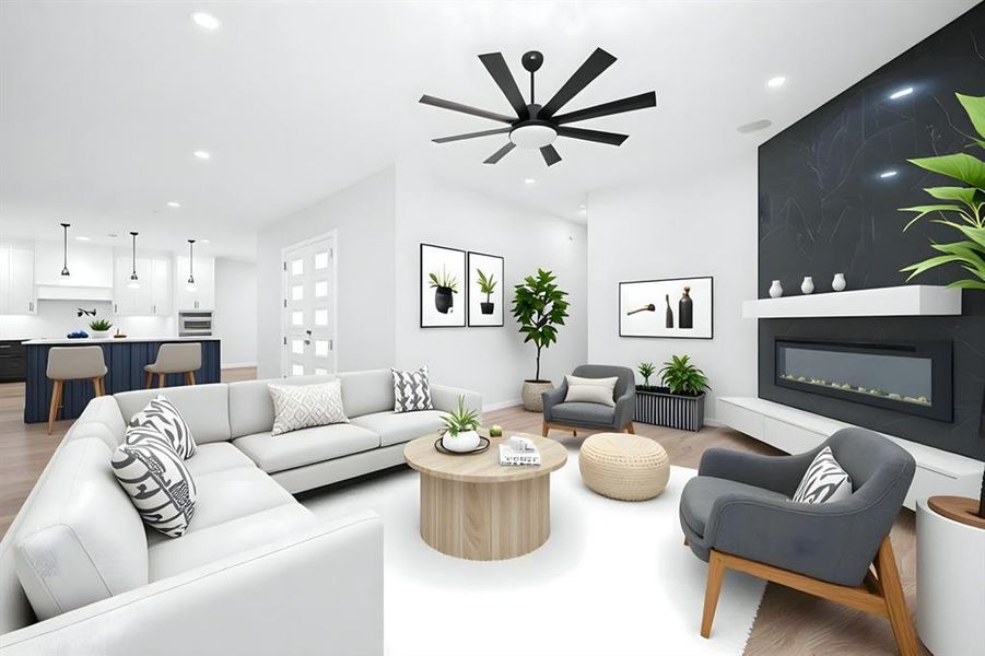 Living room with a large fireplace, light wood-style floors, ceiling fan, and recessed lighting