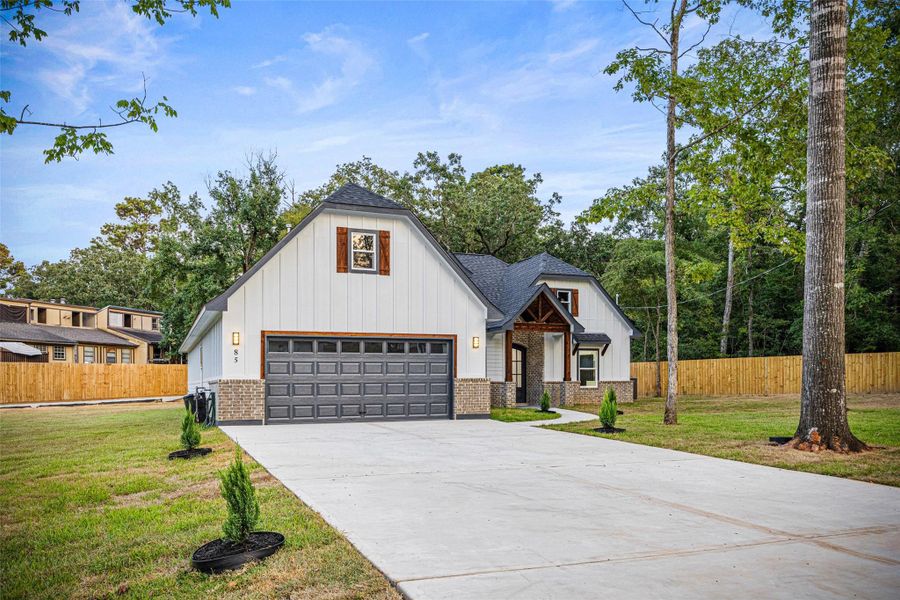 Front exterior of a new home in , Conroe, TX, highlighting curb appeal (Image 2).